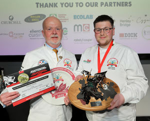 Calum Smith receives the Junior Chef of Wales trophy from Colin Gray, CAW chairman of judges. Picture: Phil Blagg