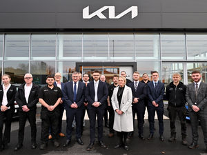 Supporting image for story: Staff celebrate as doors open at state-of-the-art car showroom
