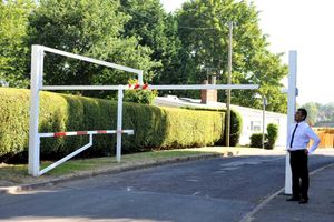Cllr Paul Singh looks at the damaged barrier
