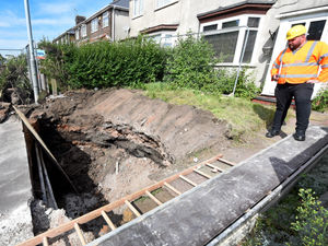 Supporting image for story: Garden dug up as new photos show scale of Wolverhampton sinkhole