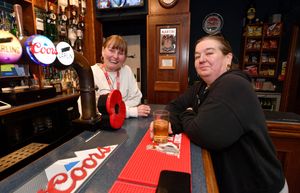 Barmaid Julie Highfield shares a joke with customer Tucka Tuckley at the Prince of Wales. Photo: Tim Thursfield