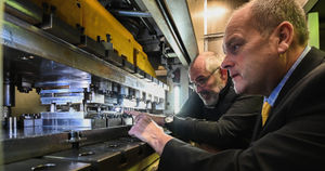 Brandauer chief executive Rowan Crozier (left) with Bruderer UK managing director Adrian Haller and the new £700,000 press