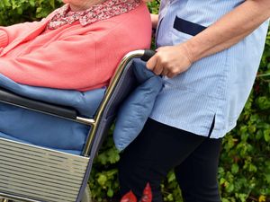 A care worker with a wheelchair