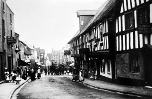 Shrewsbury. Frankwell street scene, with the String of Horses pub on the right. On right nearest camera the sign is for E Owen, pump maker and well sinker. Edward Owen was known as Neddy Pump. Picture dates from around the beginning of the 20th century