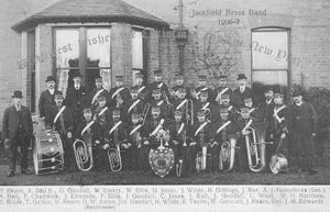 A Christmas and New Year postcard from 1906-1907, featuring the band outside the old Jackfield Rectory.