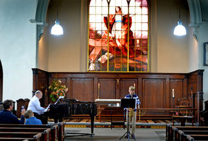 Young musician Frank Thompson, aged 12, plays his instrument with (left) church organist Jeremy Lund, at Saint Alkmunds Church, Shrewsbury