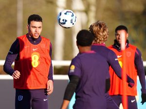 Morgan Rogers, left, looks on in training