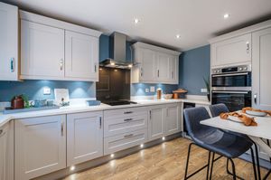 A typical kitchen and dining area in a four bedroom Woodcote
