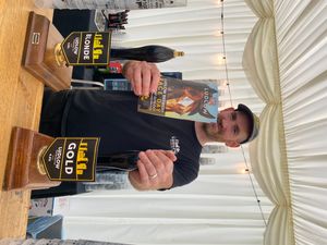 Martyn Jones from Ludlow Brewing Company behind the bar in The Windsor Marquee ready to pull pints for thirsty racegoers