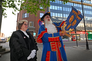At 8am on Pride Hill, Shrewsbury, Town Crier Martin Wood starts the commemorations by joining town criers from around the world to read the proclamation
