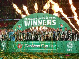 Newcastle United’s Bruno Guimaraes and Kieran Trippier lift the Carabao Cup trophy