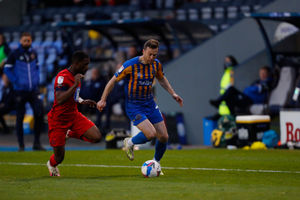 Shaun Whalley of Shrewsbury Town and Tendayi Darikwa of Wigan Athletic (AMA)