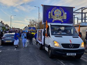 Drums could be heard from the trucks leading the parade