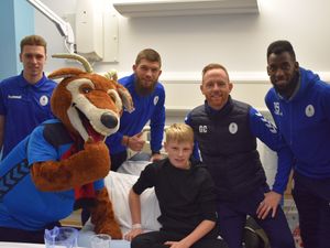 Supporting image for story: AFC Telford players deliver Christmas presents during hospital visit