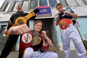 Rising kickboxing stars, Lilimae Marson, 14, and Molli Marson 12, at Central Square Nightclub which is the base for JL Security who have sponsored the girls. Pictured with them is Paul Lucas