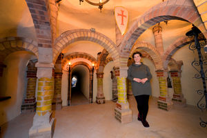 Karolina Harte, owner of Dracup's Cottage, in the house's unusual sandstone cave
