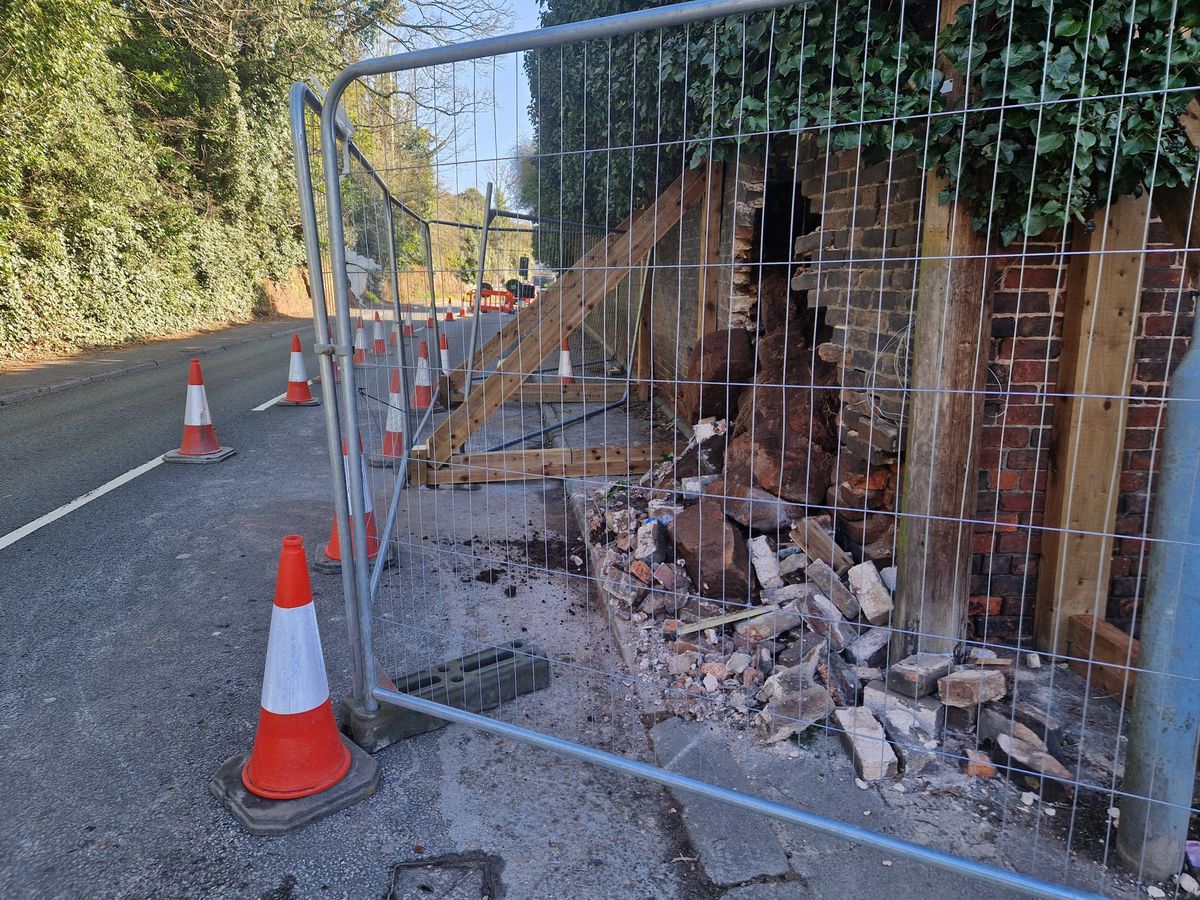 Wall collapses on Dudley road with debris and bricks scattered over pavement - causing traffic delays