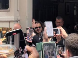 Supporting image for story: Johnny Depp mobbed by Midlands fans, poses for photos ahead of Symphony Hall show