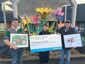 Supporting image for story: Farmers hand over cheque to charity following festive tractor run