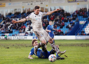 Adam Cowen of Stockport County and Andy Owens of AFC Telford United