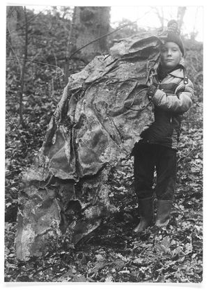 Eight-year-old Gavin Webb with part of the cowling of an Airspeed Oxford at Wassell Wood near Bewdley, found by his father in April 1981. 