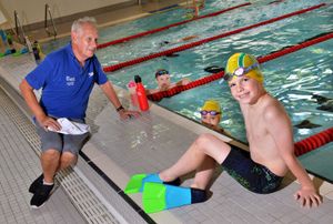 Head coach Paul Grainger is pictured with swimmers William Killeen, 8, Alex Davis, 11, and Olly Blakemore, 9, as they get back to training after months of lockdown