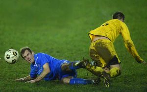 Jason Pike of Bridgnorth fouls Ryan Guryn of Wellington