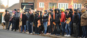 Firefighters demonstrate outside West Midlands Fire Service headquarters in Birmingham