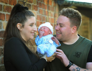 Roman Gray Hulme, parents Lexi Shinton, and David Hulme