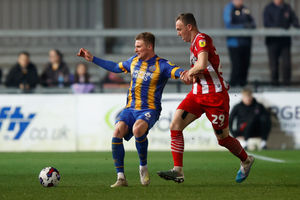 Taylor Moore of Shrewsbury Town and Kevin McDonald of Exeter City (AMA)