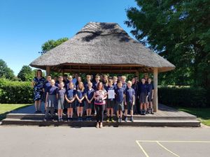Supporting image for story: School presented with memorial cup for Poppy Appeal efforts