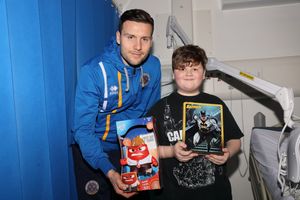 Matt Sadler of Shrewsbury Town with Paul Podmore, 12, from Telford  