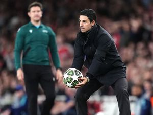 Arsenal manager Mikel Arteta hurries to get the ball back in play against Paris St Germain