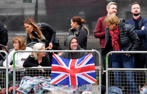 Flags tied to fences in Hyde Park. 