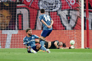Aston Villa goalkeeper Emiliano Martinez makes a save 