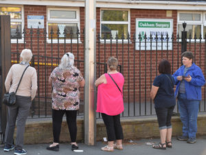 Supporting image for story: Frustrated patients queue outside surgery in a desperate bid to get an appointment