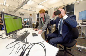 Trying on a VR headset at Dudley College