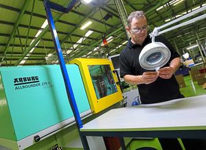 Rick Jones examines a product from a mould