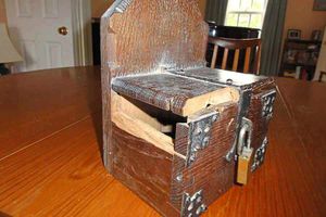 Damaged donation box at St Mary's Church in Clunton