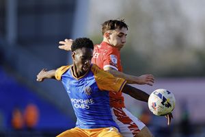 Trey Ogunsuyi battles for the ball against Crewe