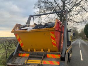 Supporting image for story: Police car almost hit by rubble falling from unsafe skip lorry