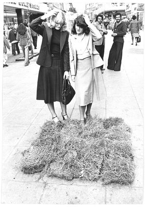 1978 - A mysterious patch of turf had appeared in the street. The photograph shows Helen Jarrams (left) and Anne Collings.