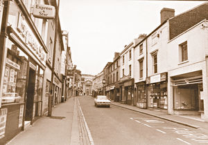 This picture of Wolverhampton Street, Dudley, was taken in August, 1971, shortly before the construction of the Trident Shopping Centre. The redevelopment resulted in many of the shops on the right of the picture being demolished.