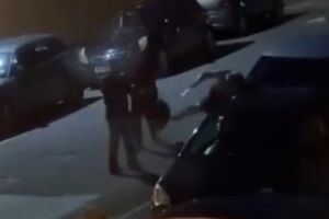 Disturbing footage shows a knife-wielding woman wildly swinging a blade while trying to slash a man in the street - before he fended her off with his rucksack.