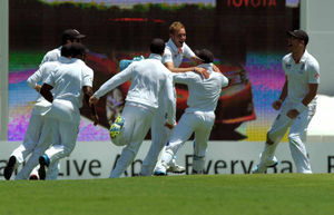 England's Stuart Broad (centre) celebrates taking the wicket of Australia's Michael Clarke (not pictured)