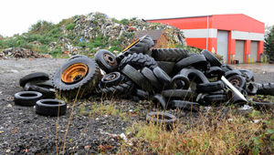Tyres are piled up in front of the mountain