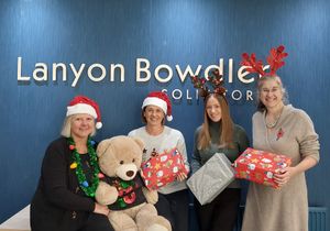 Lanyon Bowdler staff, Amanda Clarke, Vicki Thomas, Natasha Gibbons and Dawn Humphries, getting ready to receive Christmas shoeboxes.
