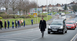 Colleagues lined the road as the procession passed