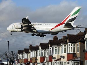 A plane prepares to land at Heathrow