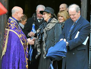 Berts daughter Ann, centre, chats outside the church